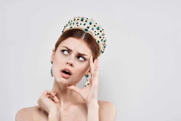 Tiara with diamonds and purple gem, isolated on white background