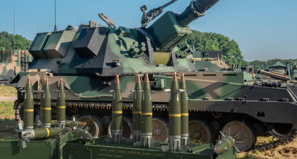istock Guided 155 mm artillery ammunition on a howitzer battle position 2152837906