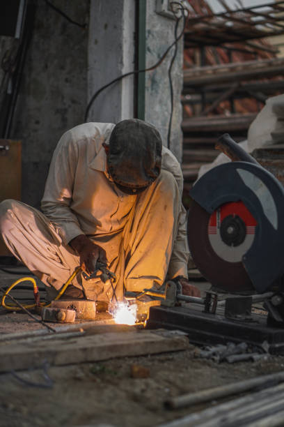 istock Skilled Welder welding metal in his Workshop 2152838477