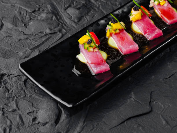 istock Gourmet tuna sashimi on black slate plate 2152843918