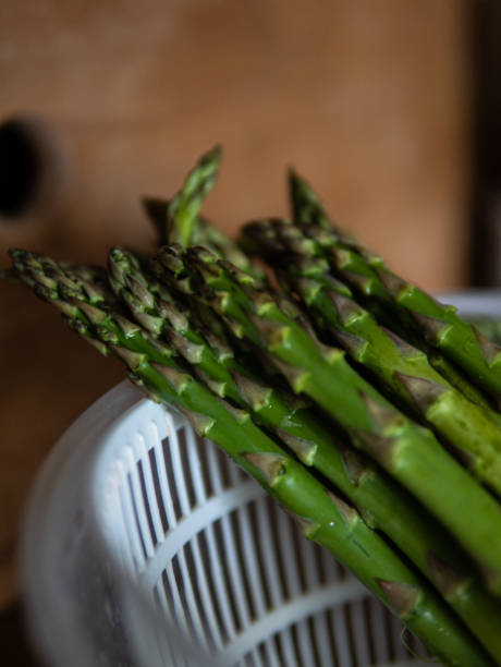 istock fresh asparagus in a frying pan 2152844203