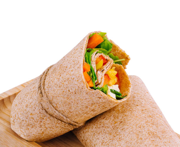 istock Fresh chicken wrap sandwich on wooden board 2152844309