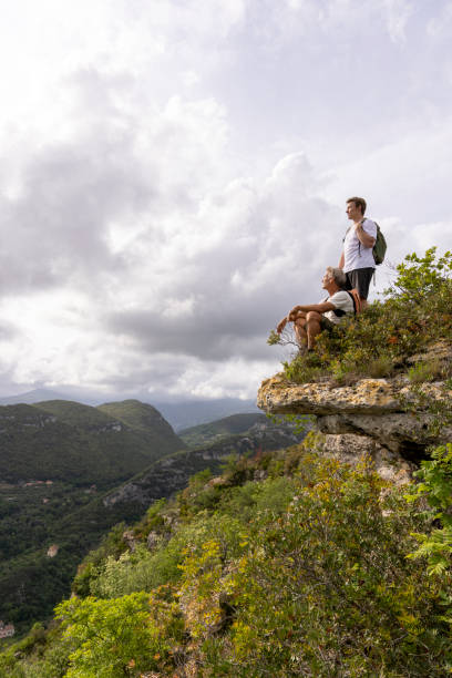 Father and son pause on hilltop