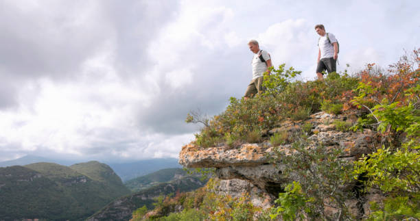 istock Father and son pause on hilltop 2152845651