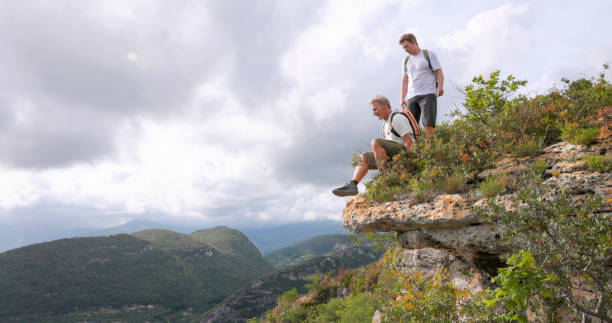 istock Father and son pause on hilltop 2152845865