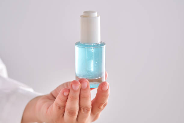 istock Blue serum with pipette in a womans hands in a robe. 2152846187