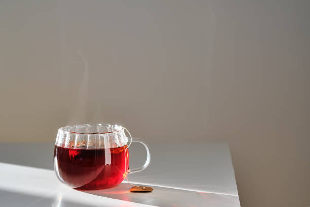 istock Glass mug with hot black tea on the table. 2152846584