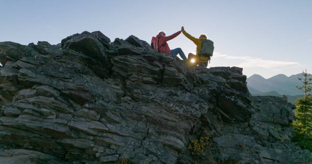 istock Senior couple high-five on mountain top 2152846661