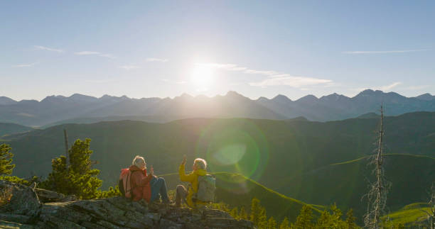 istock Senior couple high-five on mountain top 2152846764