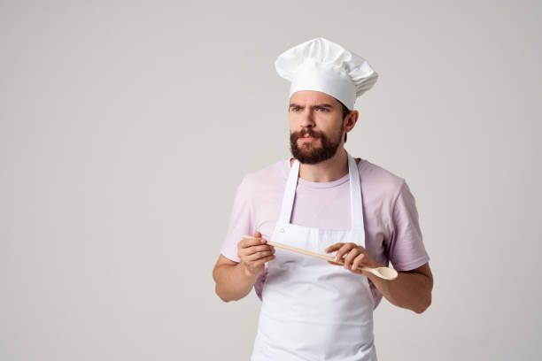 istock bearded man chef with a white cap on his head emotions work 2152847012