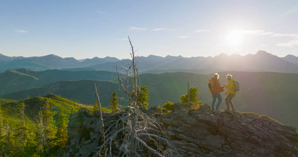 istock Senior couple high-five on mountain top 2152847111