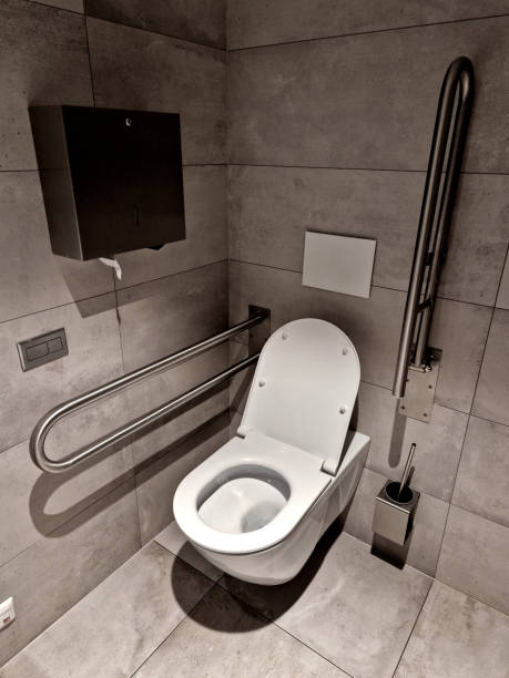 istock toilets for wheelchair users and disabled people have a tilting mirror that points to the ground because the height of the person sitting is lower. lever taps for easier water temperature adjustment 2152848323