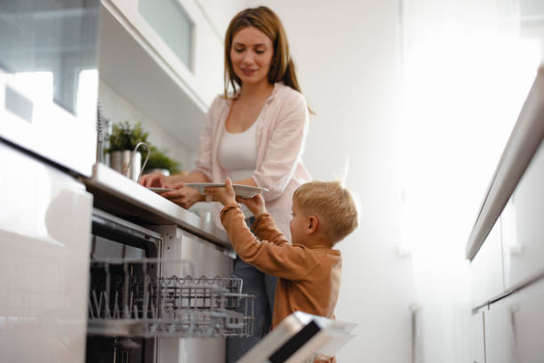 istock Mother and Son Doing the Dishes 2152850035