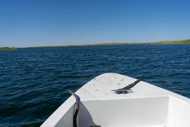 a boat in a middle of a big lake