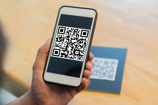 istock Man use smartphone to scan QR code for order menu in cafe or restaurant with a digital delivery. 2152852554