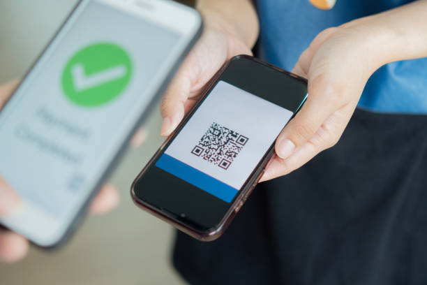 istock Selective focus of hand holding phone and scanning qr code. QR code payment and cash technology concept. 2152852572