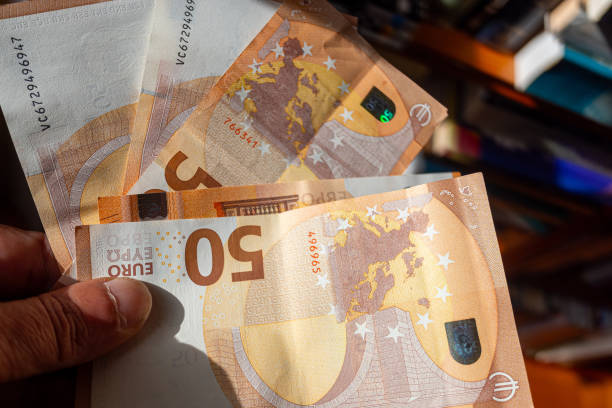 istock hand holding several 50 euro banknotes 2152853563