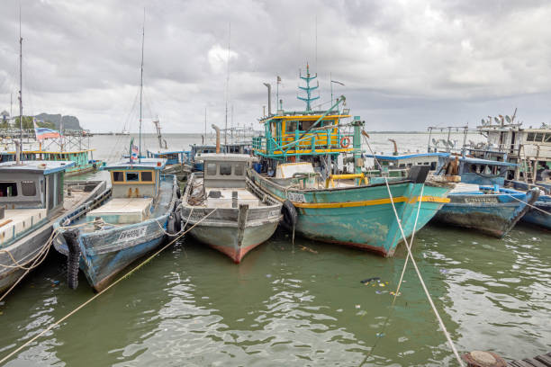 Sandakan, Eastern Borneo, Malaysia - February 12th 2024:  Fishing is a major occupation in Sandakan and there are always moored fishing boats outside the market, where the fresh catch is sold