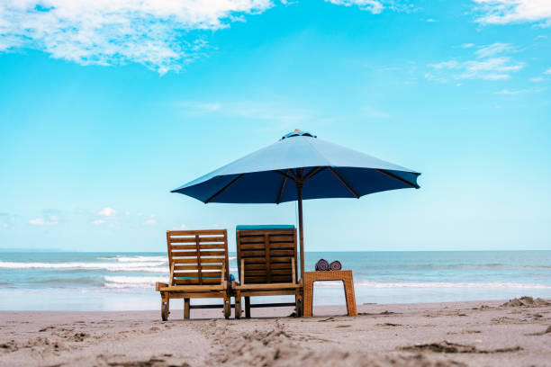 istock beach chairs and umbrellas 2152858913
