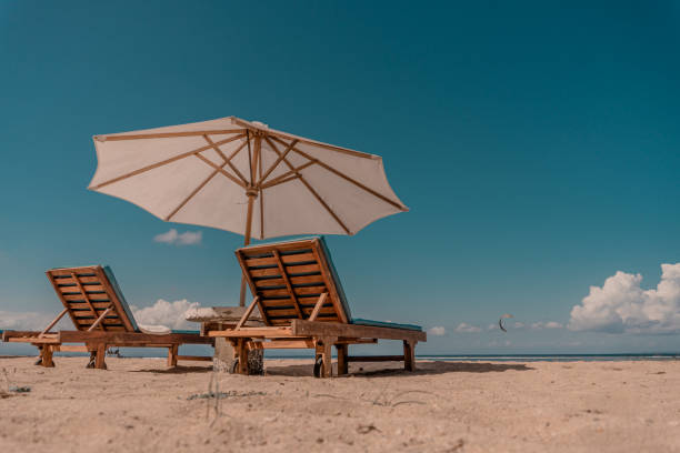 istock beach chairs and umbrellas 2152858922