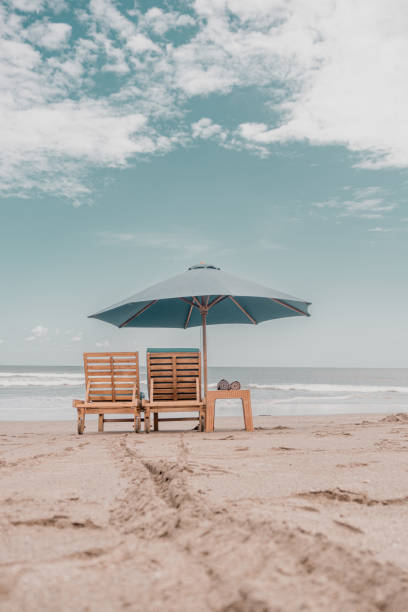 istock beach chairs and umbrellas 2152858941
