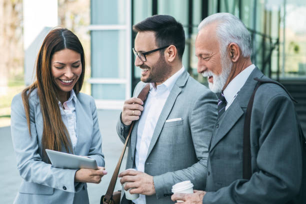 istock Colleagues Reviewing Tablet Together 2152859748