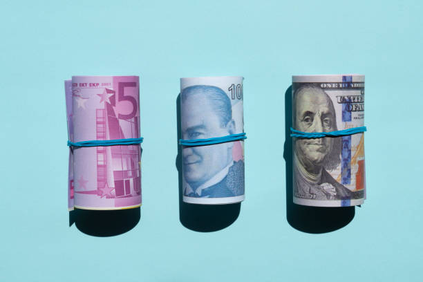 istock American dollar, Euro with Turkish Lira rolls flat lay on blue background 2152860621