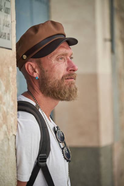 istock Serious bearded hipster standing on street 2152861612