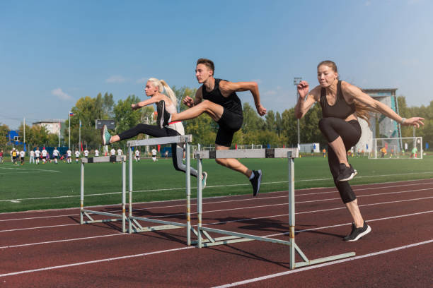 istock Two athlete woman and man runnner running hurdles 2152861795
