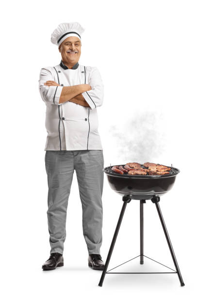 istock Chef next to a portable barbecue grill 2152862866