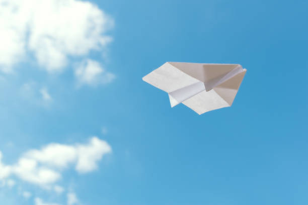 istock Paper plane flying against blue sky 2152865206
