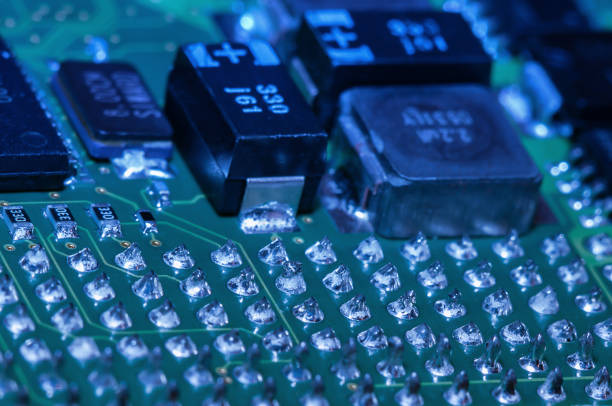 istock Closeup of Printed Circuit Board with processor, integrated circuits and many other surface mounted passive electrical components. 2152865278