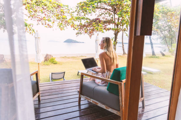 istock Woman Working Remotely from Beachside Porch 2152867117