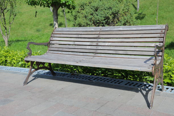 istock a wooden bench on the street 2152868820