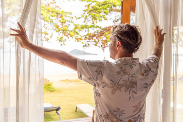 istock Man On Vacation Checking Into His Hotel Room 2152868968
