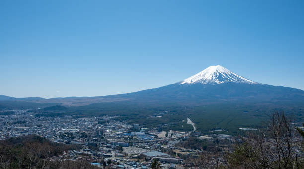 istock Fuji Mountain in Japan, snow capped peak in Spring, blue clear sky 2152869545
