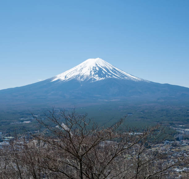 istock Fuji Mountain in Japan, snow capped peak in Spring, blue clear sky 2152869607