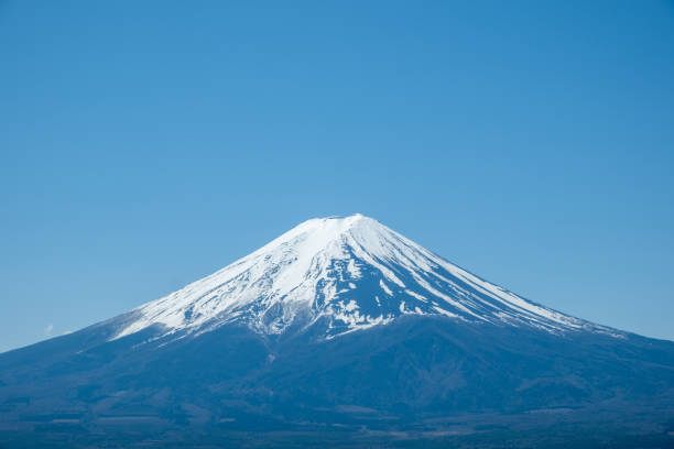 istock Fuji Mountain in Japan, snow capped peak in Spring, blue clear sky 2152869609