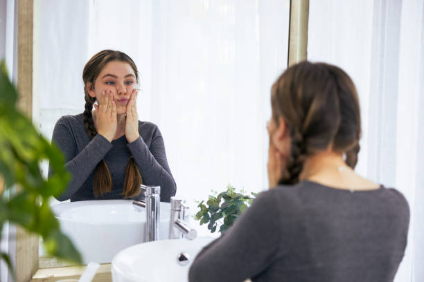 istock Cute teenager getting ready in the bathroom 2152871136