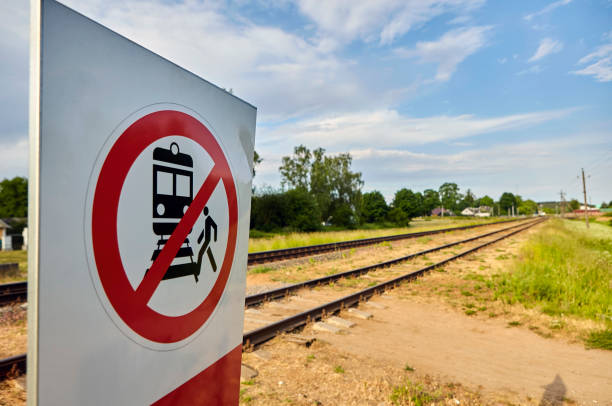 istock Warning Sign Prohibiting Access to Railway Tracks Under the Bright Sunlight 2152871683