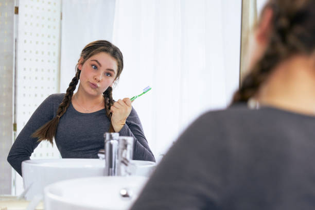 istock Cute teenager getting ready in the bathroom 2152871686