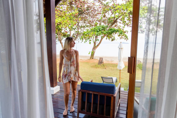 istock Woman enjoying morning beach view 2152873745
