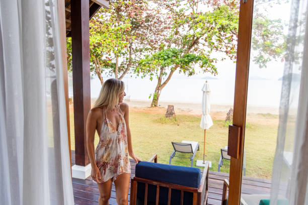 istock Woman Enjoying Beach View from Porch 2152873755