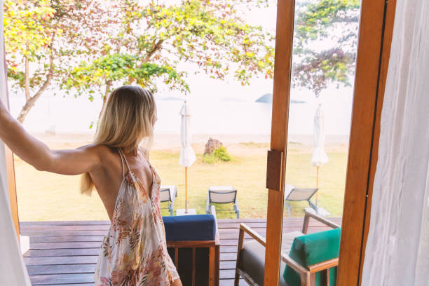 istock Woman Enjoying Beachfront Patio 2152873757