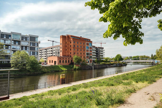 Old granaries and green park on the coast of the Brda river in Bydgoszcz, Poland