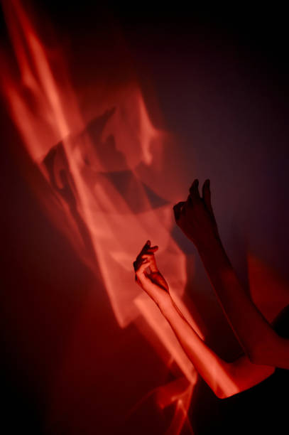 istock Hands in red light. Abstraction. Shadow theatre, hallucinations. 2152874615
