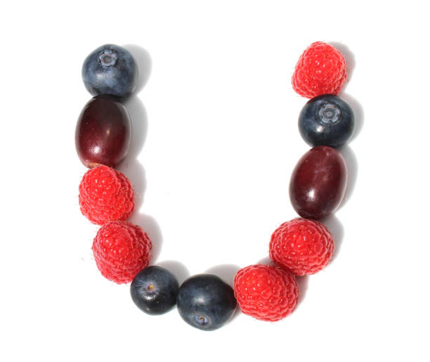 istock letter U made from raspberry, blueberries, grape. isolated berries letter 2152875353