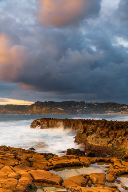 istock Sunrise, sea, waves, clouds and tessellated rock platform 2152875724