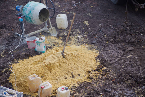 istock Construction site with a small concrete mixer, sand and shovels, small construction, home building, small construction site 2152875767