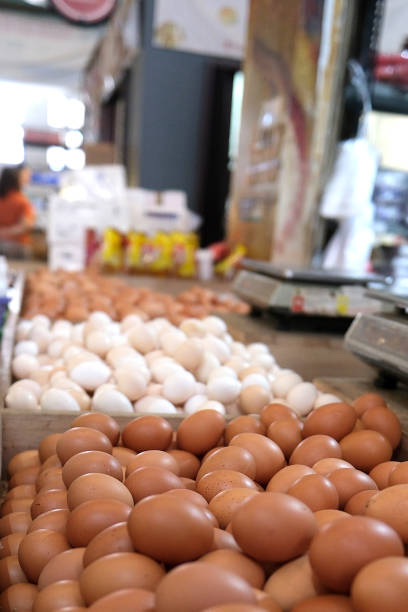 Chicken eggs displayed in a basket in a shop in the market
